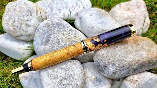 Luxury wooden fountain pen with acacia burl wood and epoxy resin close-up detail