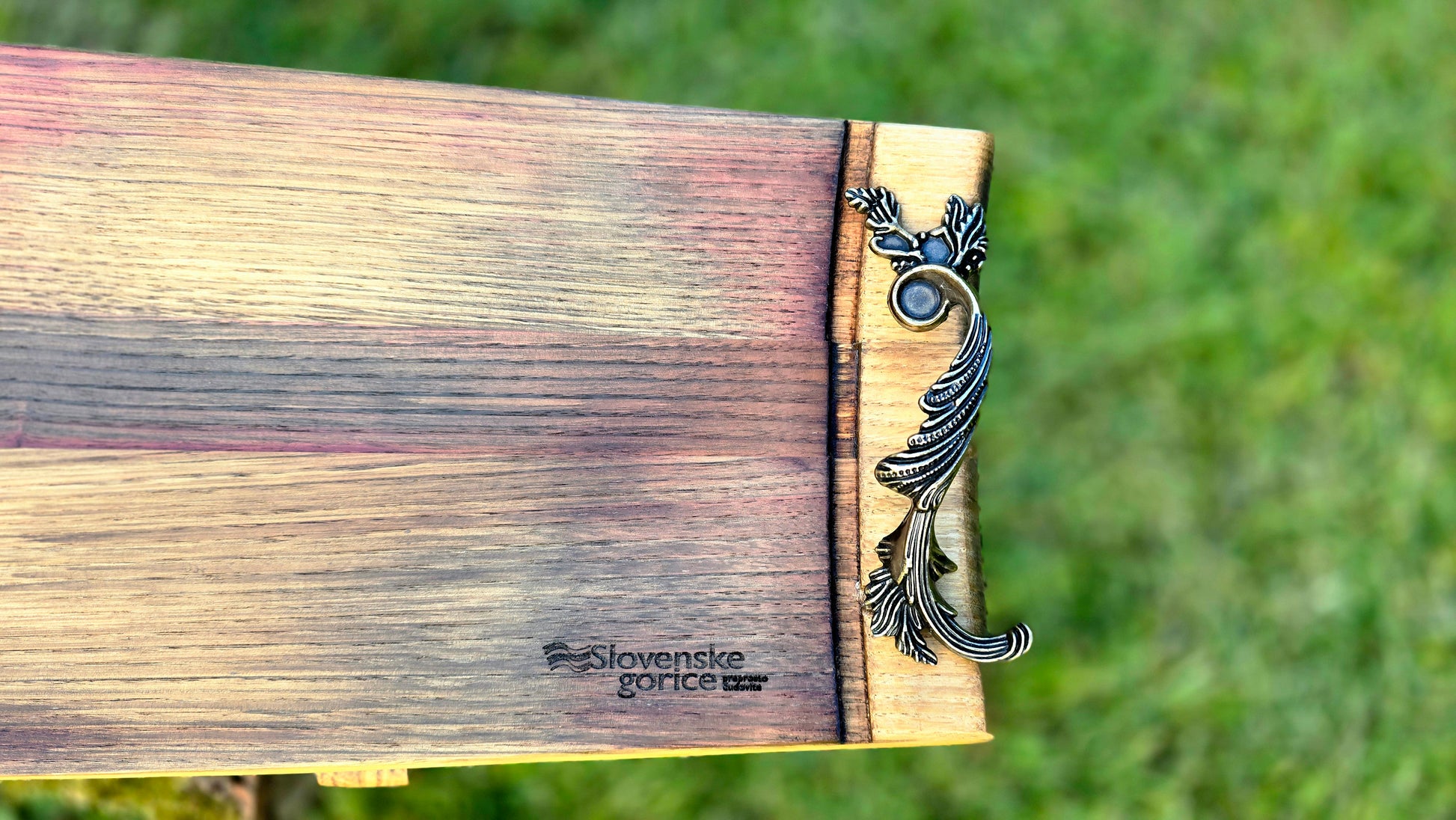 Handmade wooden serving platter showing natural grain and curved design