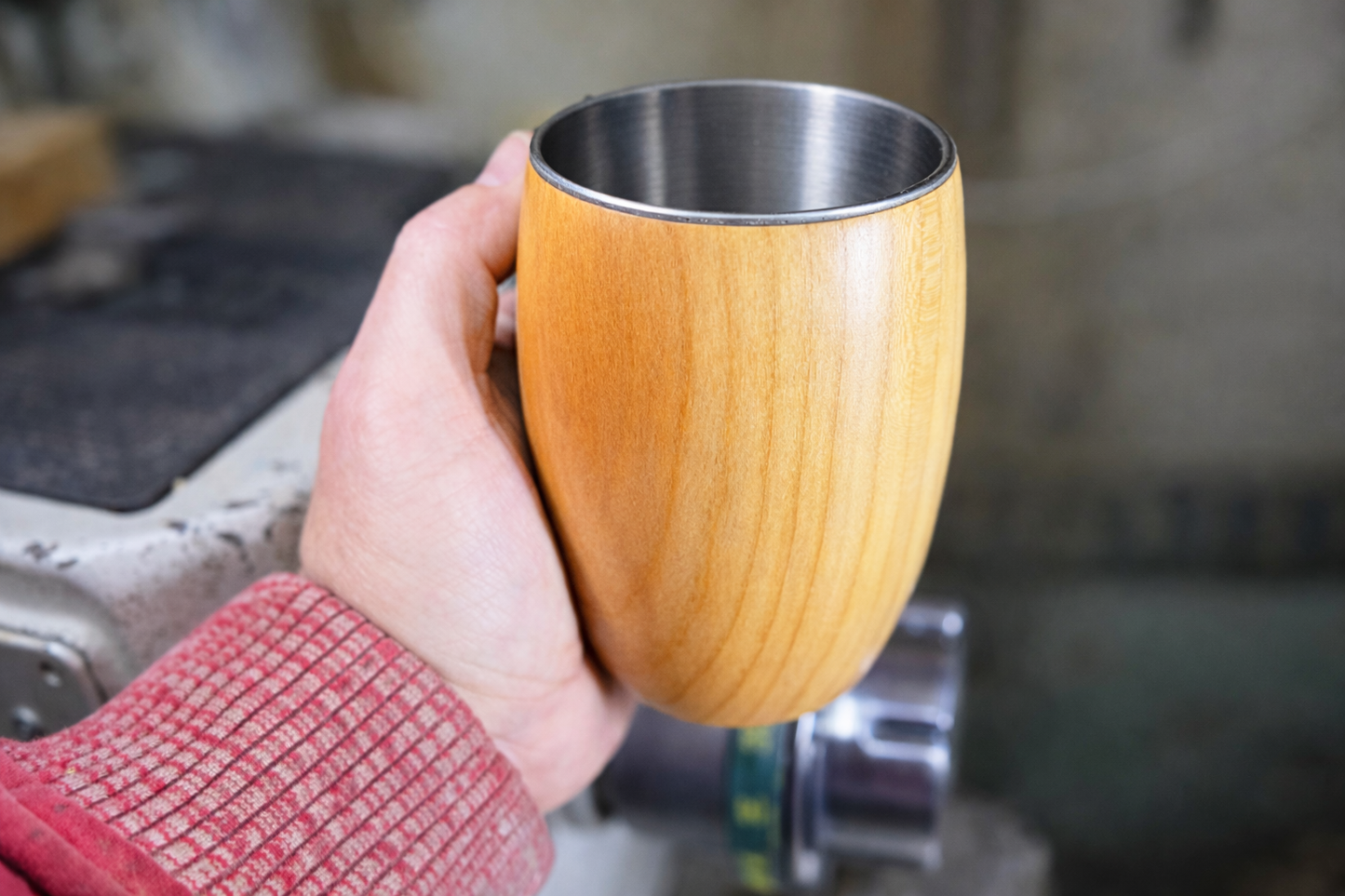 Angled view of handcrafted cherry wood coffee cup luxury drinkware