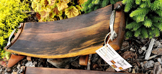 handmade reclaimed wine barrel wood serving board on rustic table