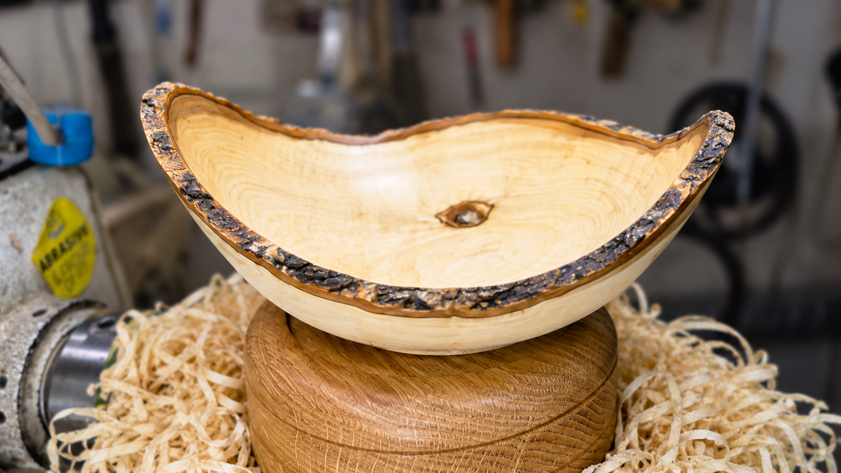 Handcrafted olive wood bowl showcasing natural live edge detail