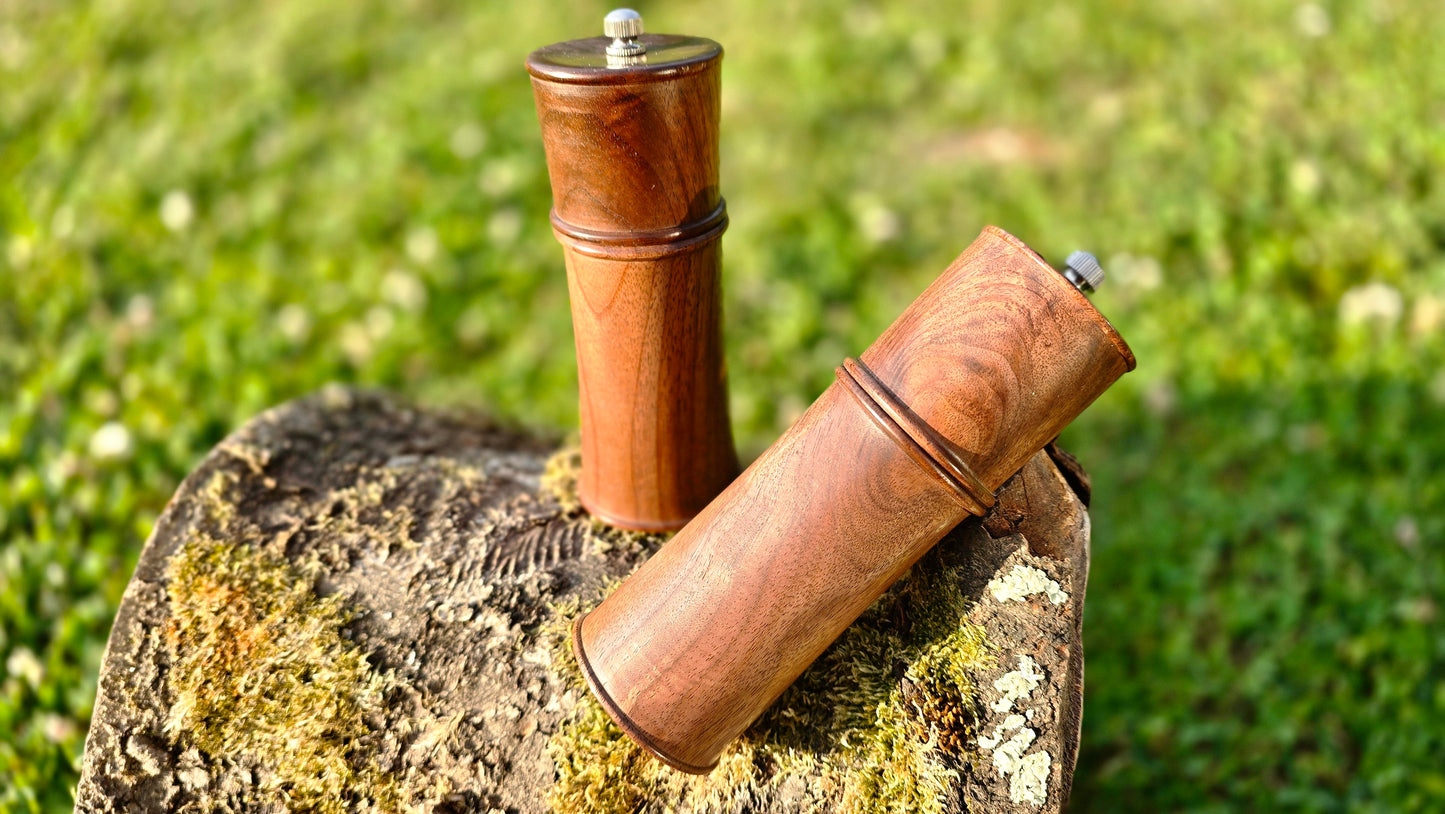Handcrafted pepper mill showing ceramic grinding mechanism and wood texture