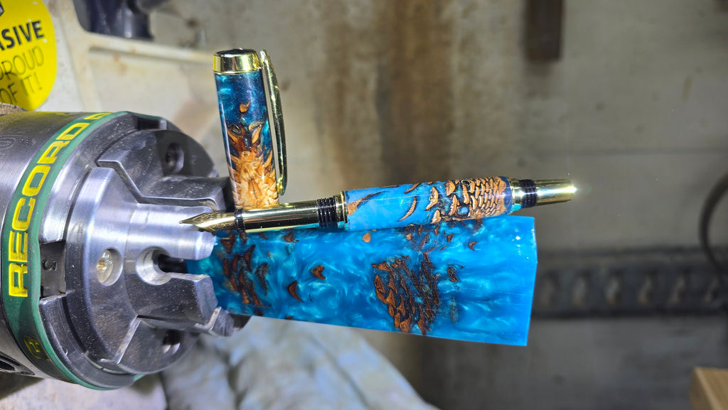 Blue pearl epoxy resin fountain pen with pine cones – handmade by PipejaWood