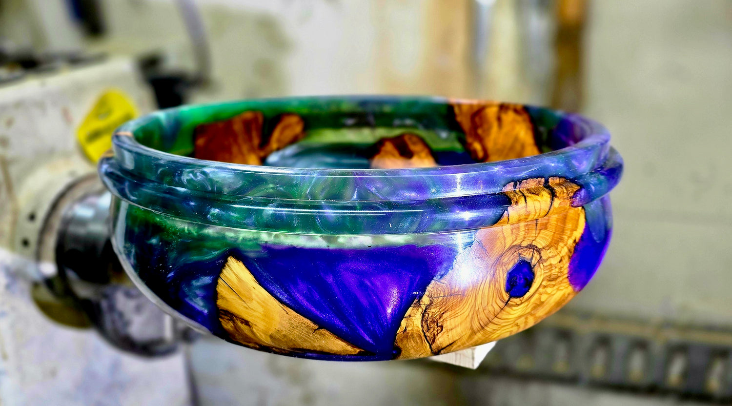 Handmade olive wood epoxy resin bowl displayed as a decorative and functional art piece