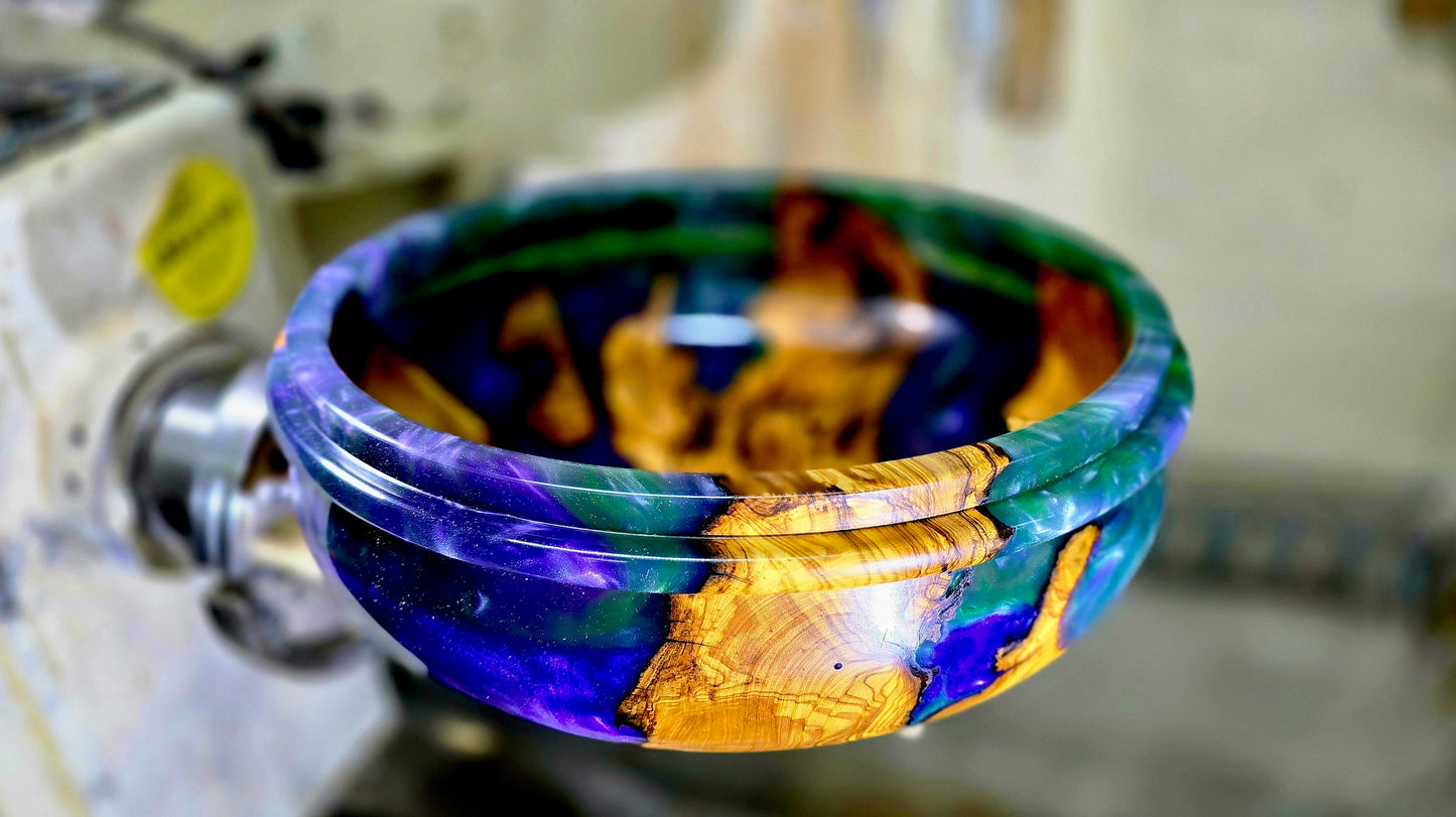 Top view of handmade olive wood and epoxy resin bowl showing natural grain and resin detail