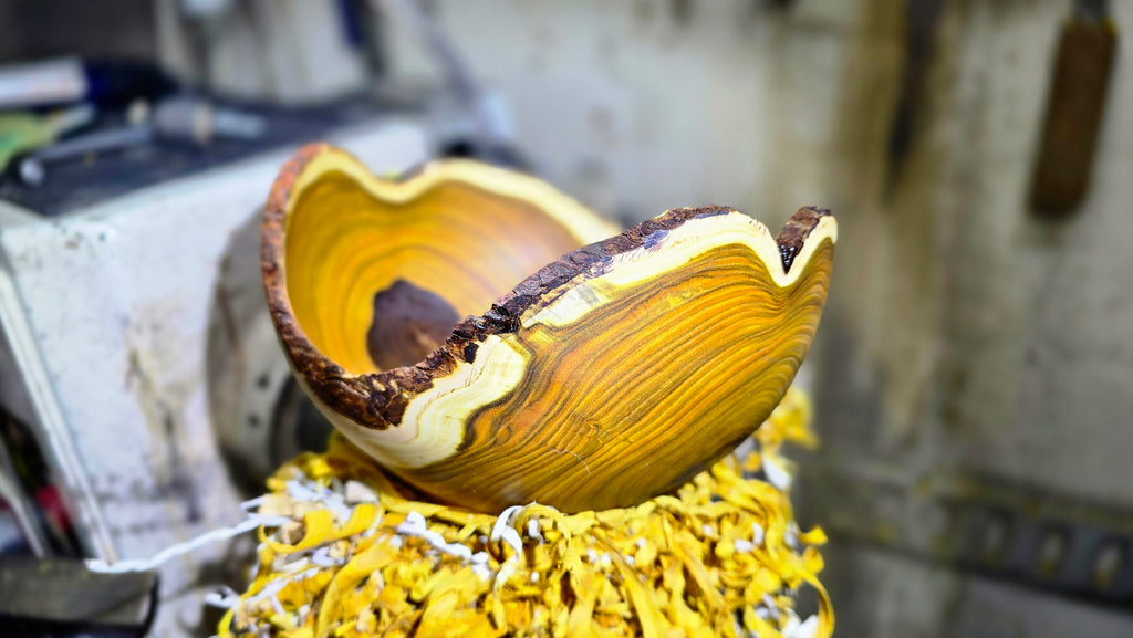 Close-up of yellow heartwood grain on handmade Rhus wood bowl