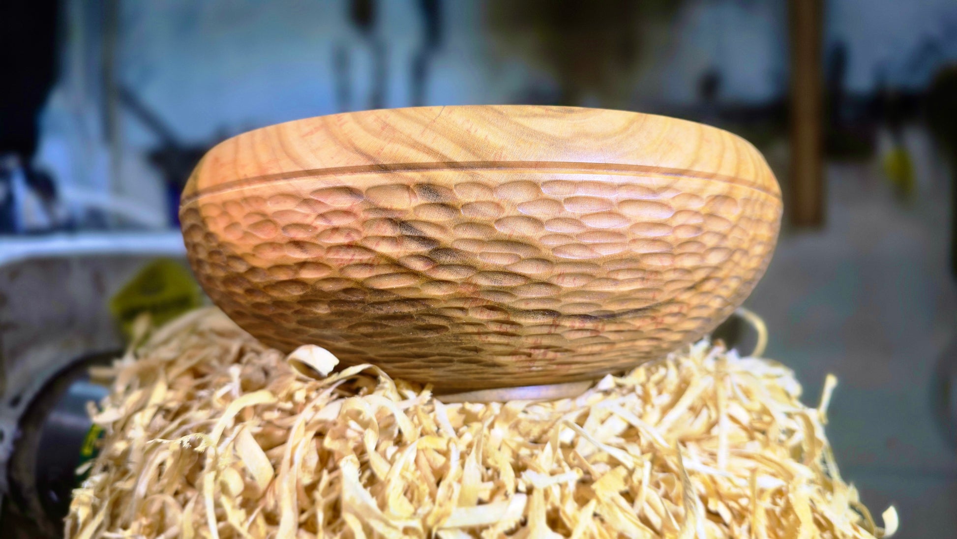 Decorative wooden serving bowl with carved texture
