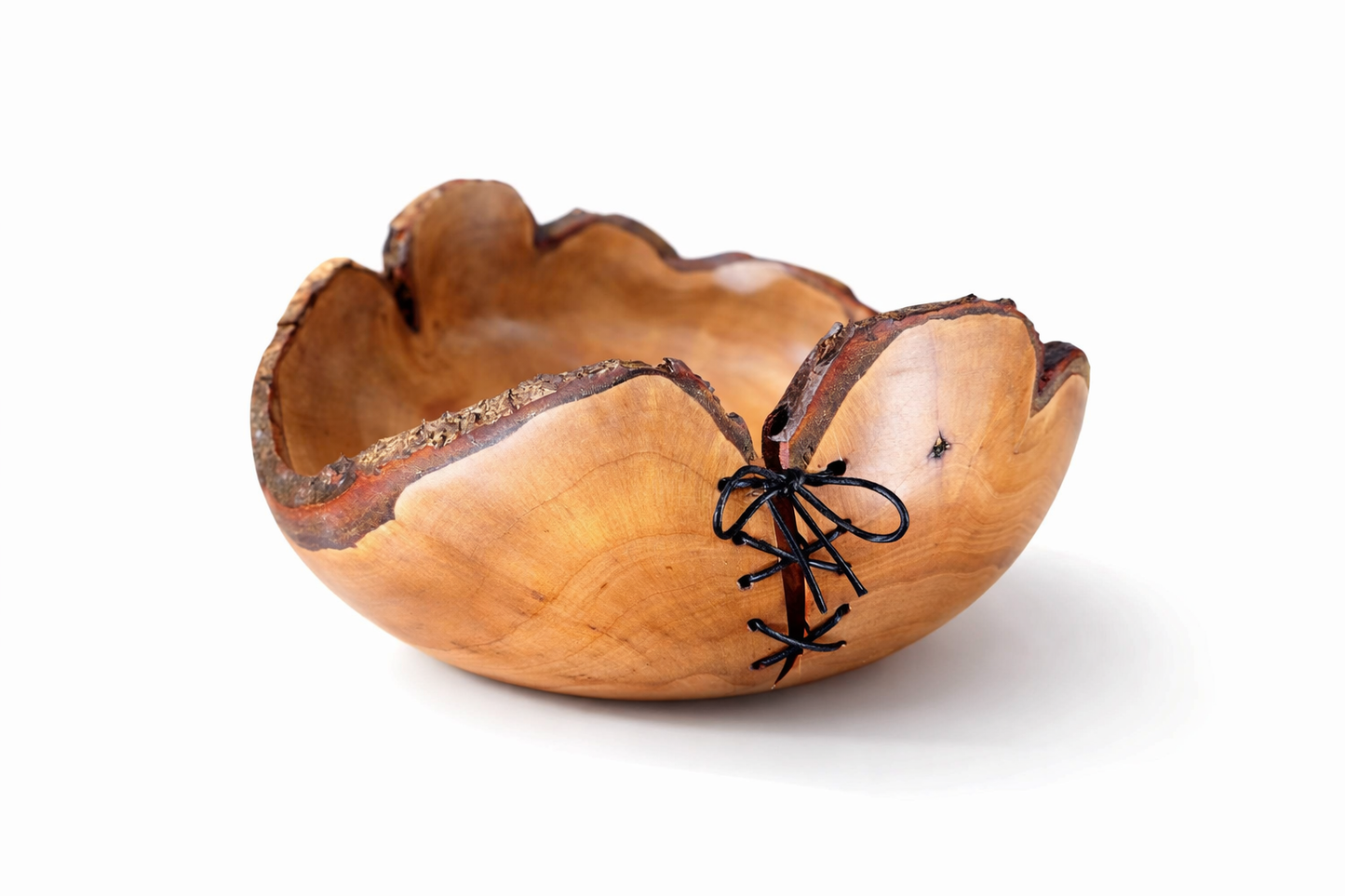 Wooden bowl with a unique design on a white background