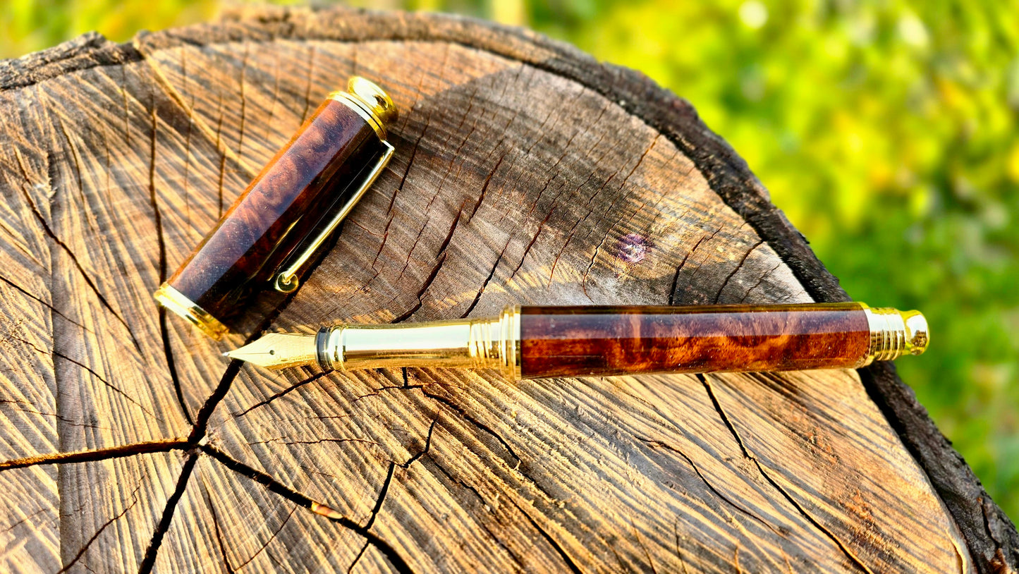 Luxury handmade walnut burl fountain pen open showing nib and handcrafted body