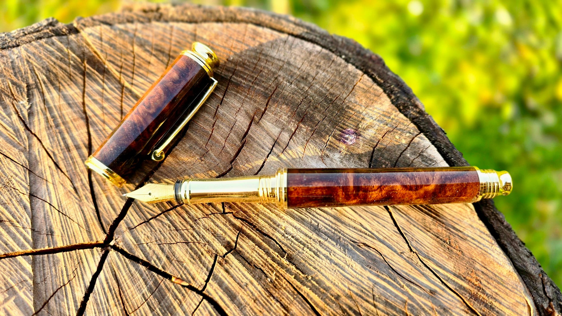 Luxury handmade walnut burl fountain pen open showing nib and handcrafted body