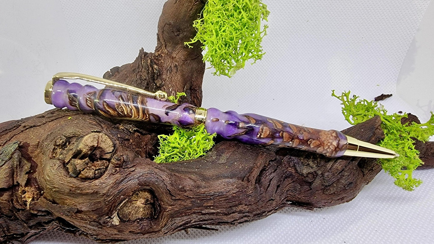 Close-up of pine cones embedded in epoxy resin handmade ballpoint pen