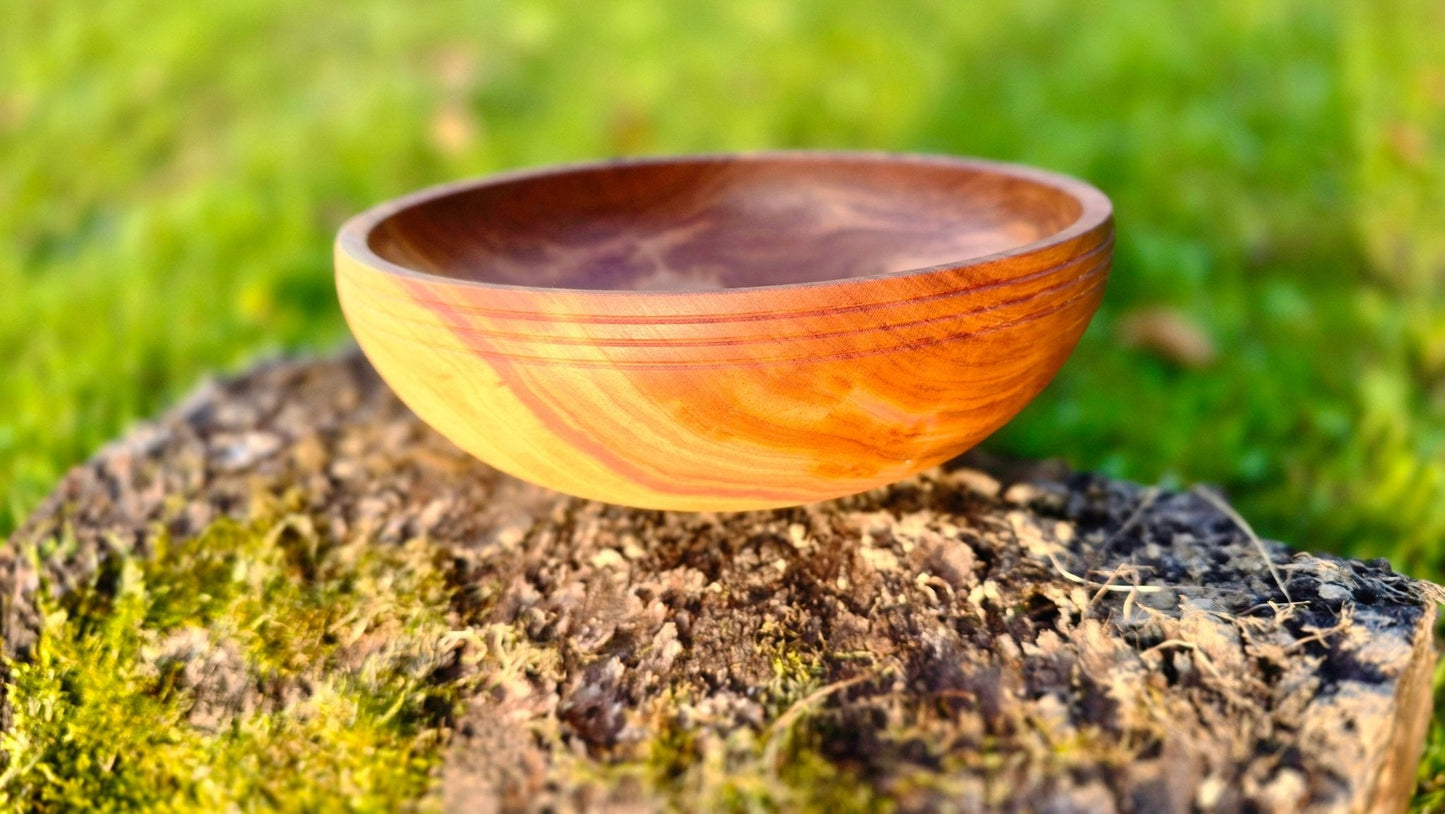 handmade plum wood bowl natural grain close up